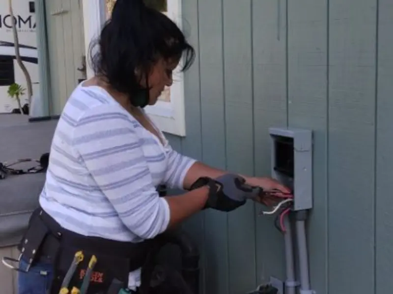 Licensed electrician wiring an exterior subpanel in Haverhill